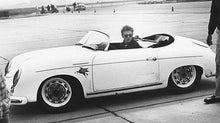 Load image into Gallery viewer, Close-up of a red Pegasus decal applied to the silver fender of a classic Spyder sports car