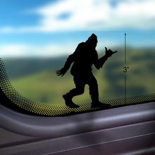 Load image into Gallery viewer, Shaka Sasquatch Bigfoot Easter egg vinyl decal on vehicle bumper

